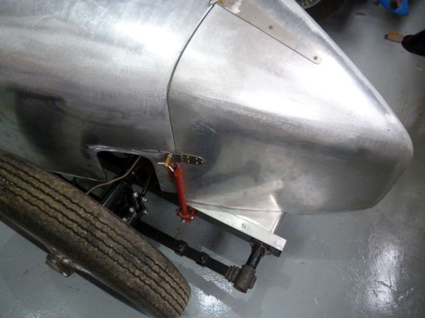 The hand-formed aluminium tail section over the rear wheel, before paint.