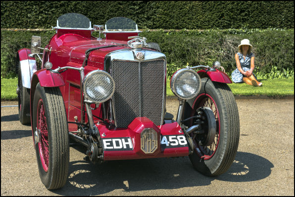 Front three-quarter view on grass, registration EDH 458 visible on the front plate.